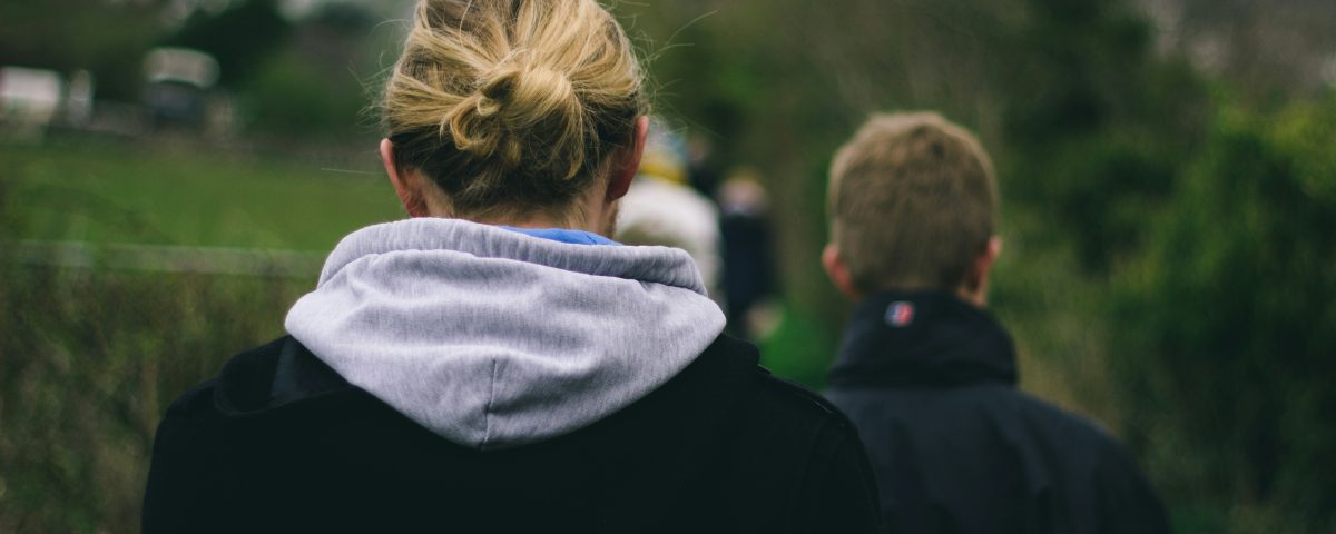 Young people walking from behind.