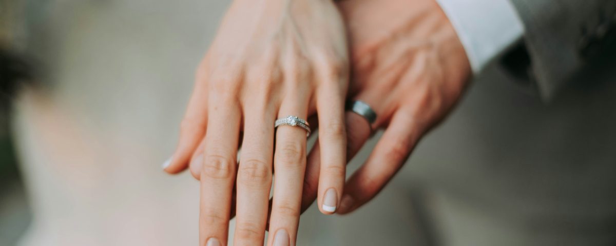 A bride and groom's hands.