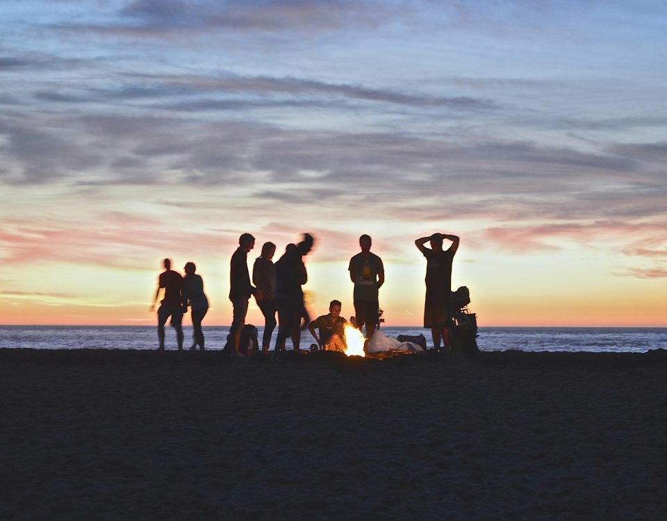 A group of friends outside at dusk.