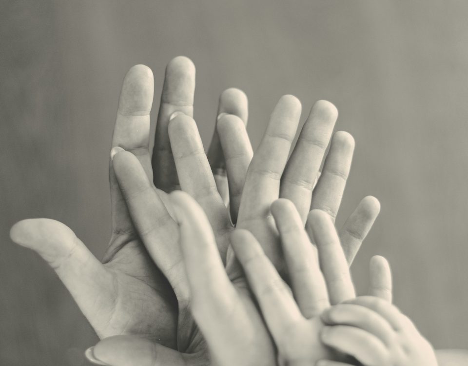 Hands on top of each other.