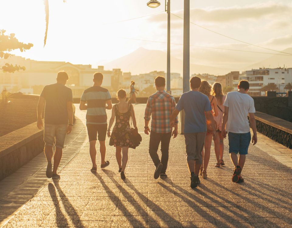 People walking away on a dock.